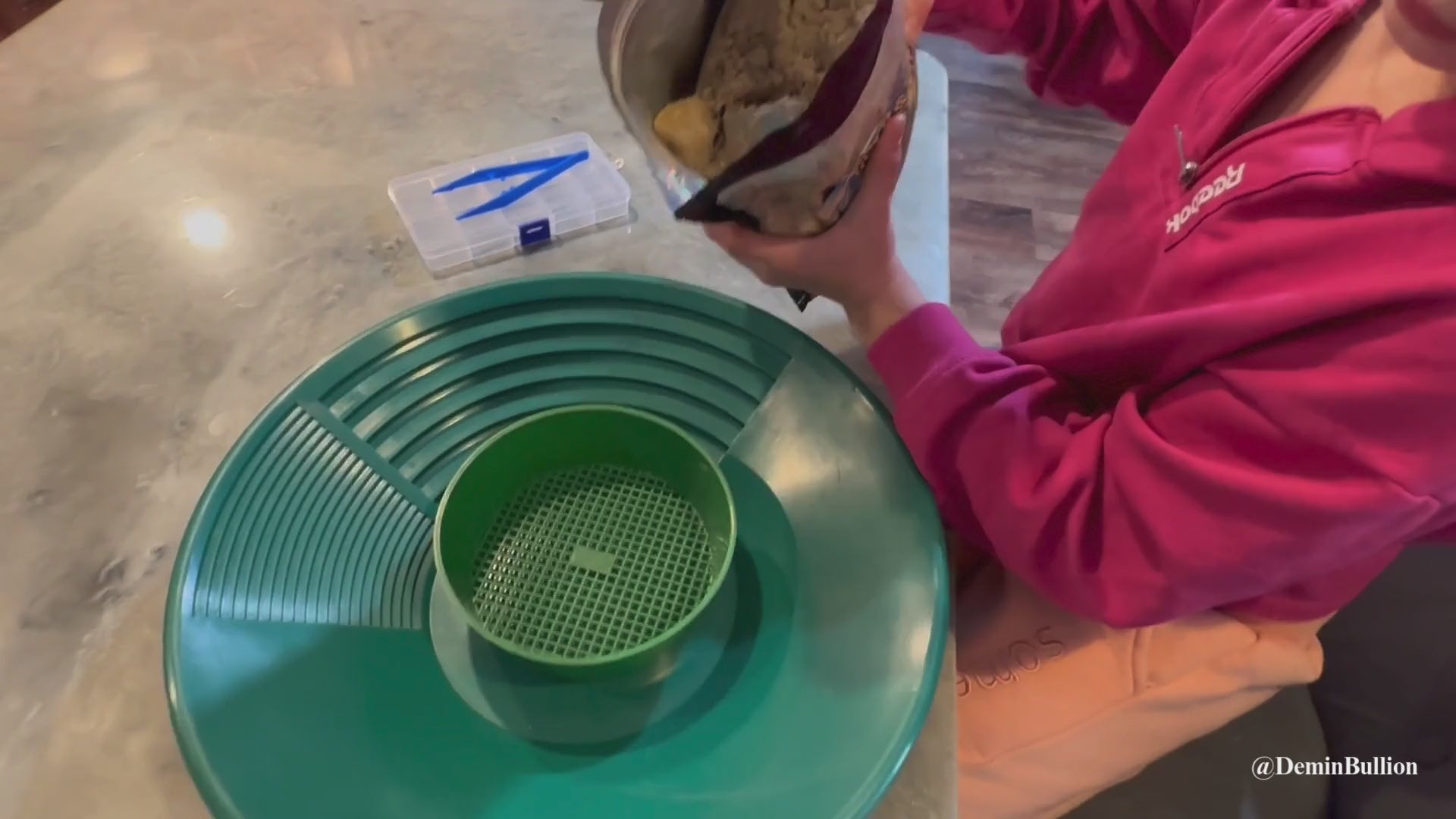 Children sorting gemstones and gold from paydirt during indoor learning activity